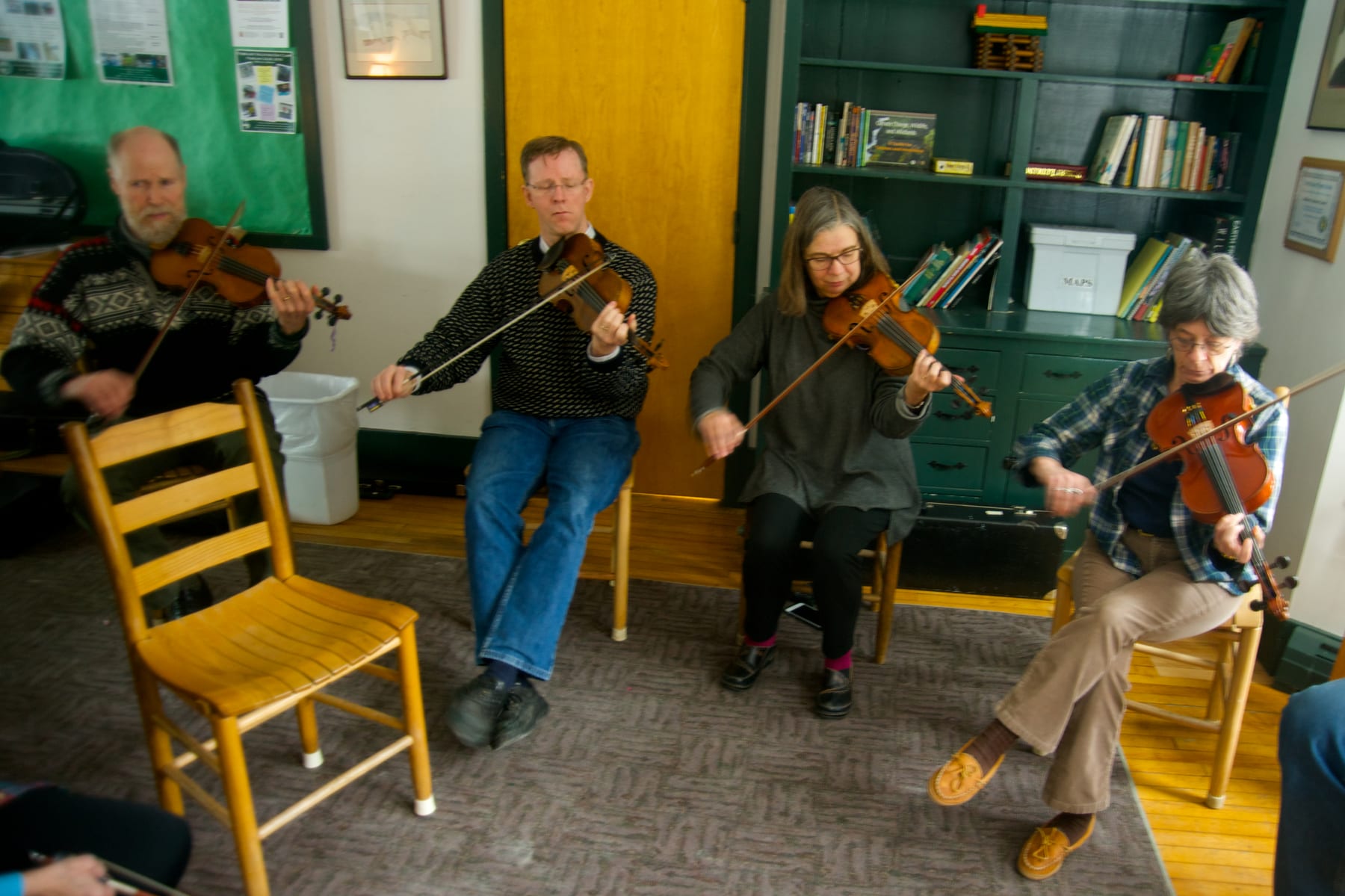 Informal jam session in the library at Hulbert Outdoor Center.