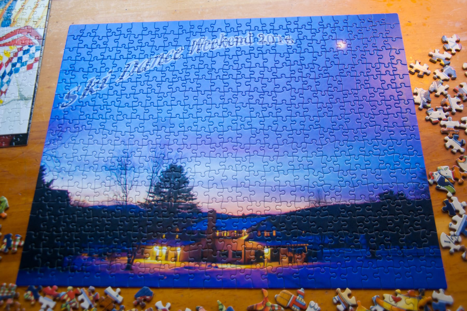 Completed puzzle depicting Hulbert Outdoor Center at sunset during Ski Dance Weekend 2016. Original photo by Tore Heskestad