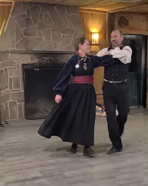 Hege and Sigbjørn, dance instructors at Ski Dance Weekend 2026, performing a Telemark Springar during the Saturday evening party.