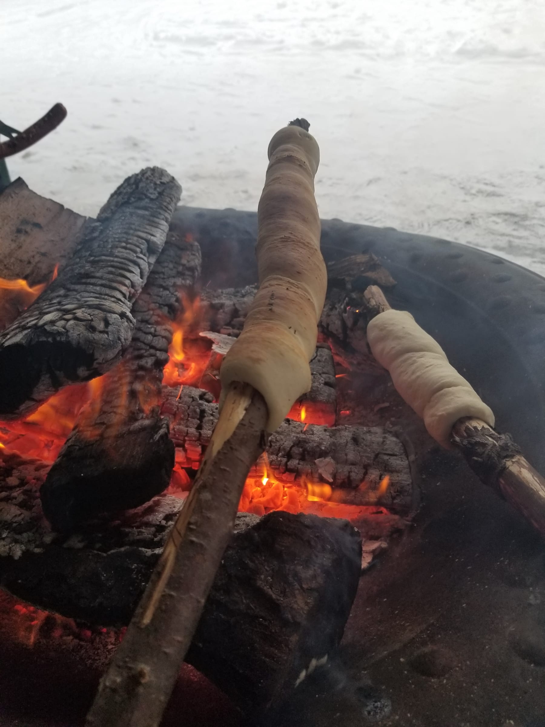 Outside making pinnebrød and roasting hotdogs