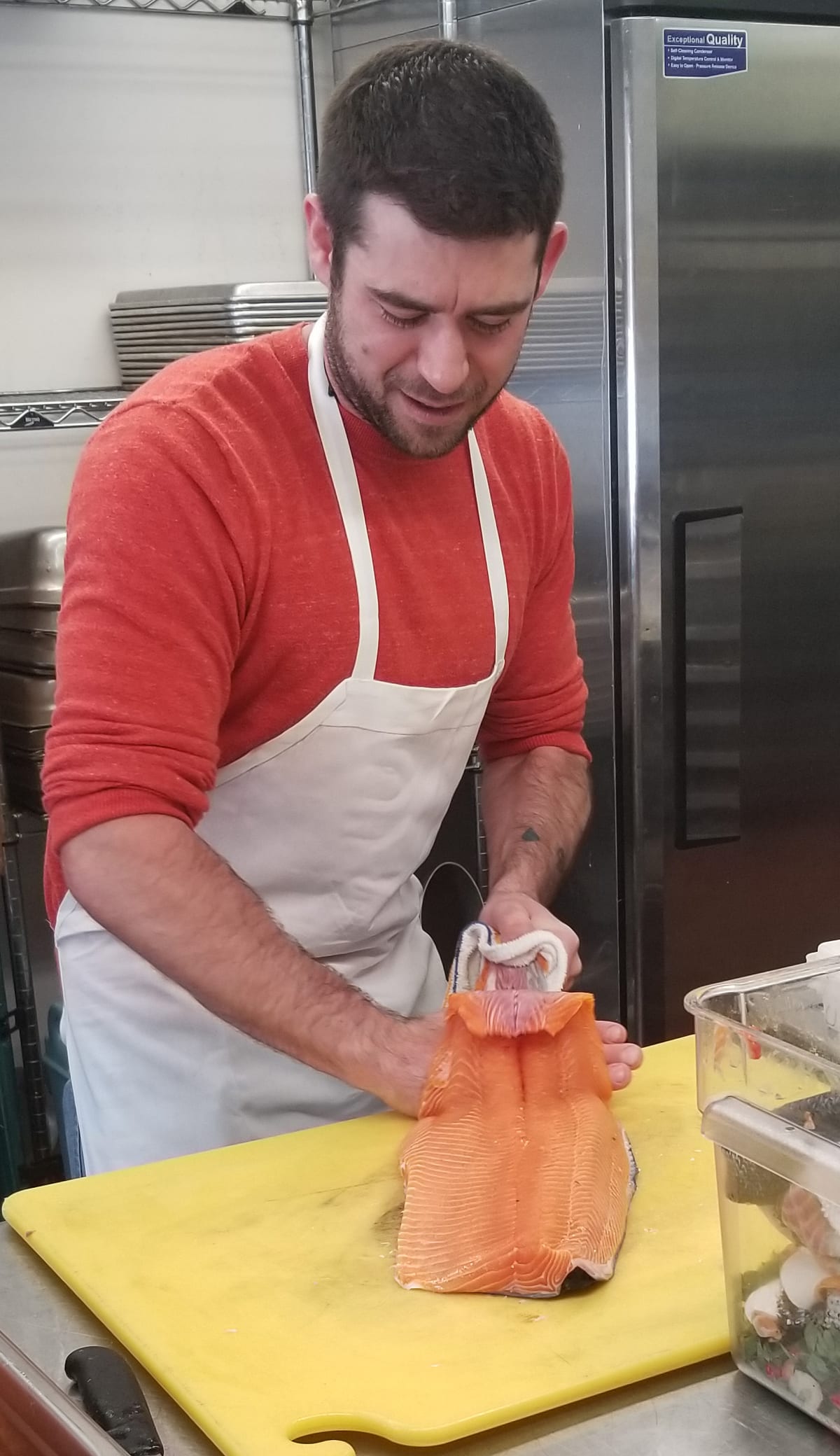 Preparing fresh salmon for the Saturday banquet