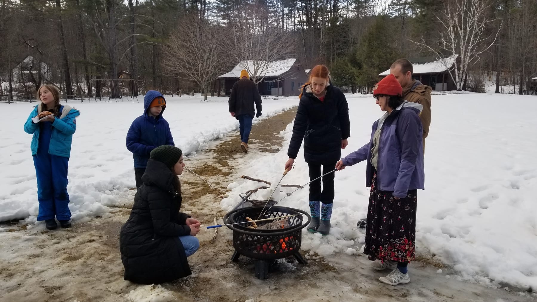 Enjoying the outdoors while making pinnebrød over an open fire